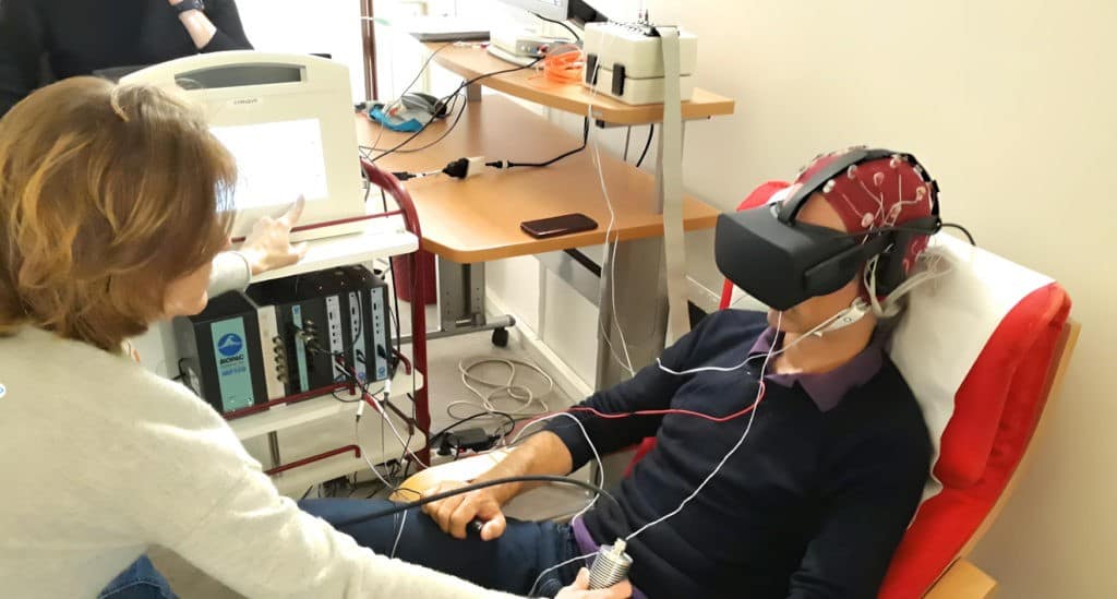 Professional hypnotherapist conducting a VR-enhanced hypnotherapy session with a client wearing virtual reality headset in a modern clinical setting